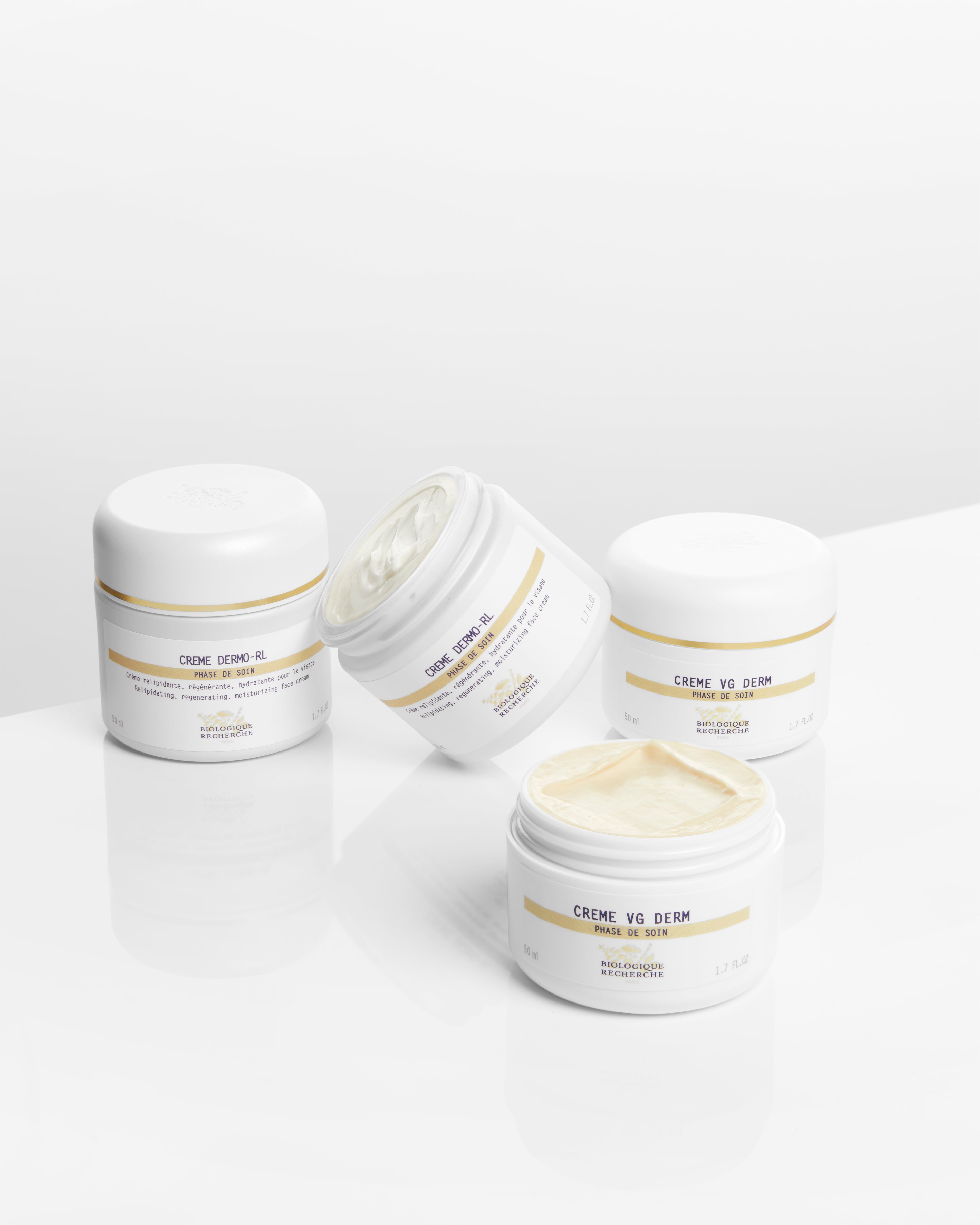 Four white jars of Biologique Recherche Crème Dermo-RL moisturizer with cream visible in one open jar on a white background.