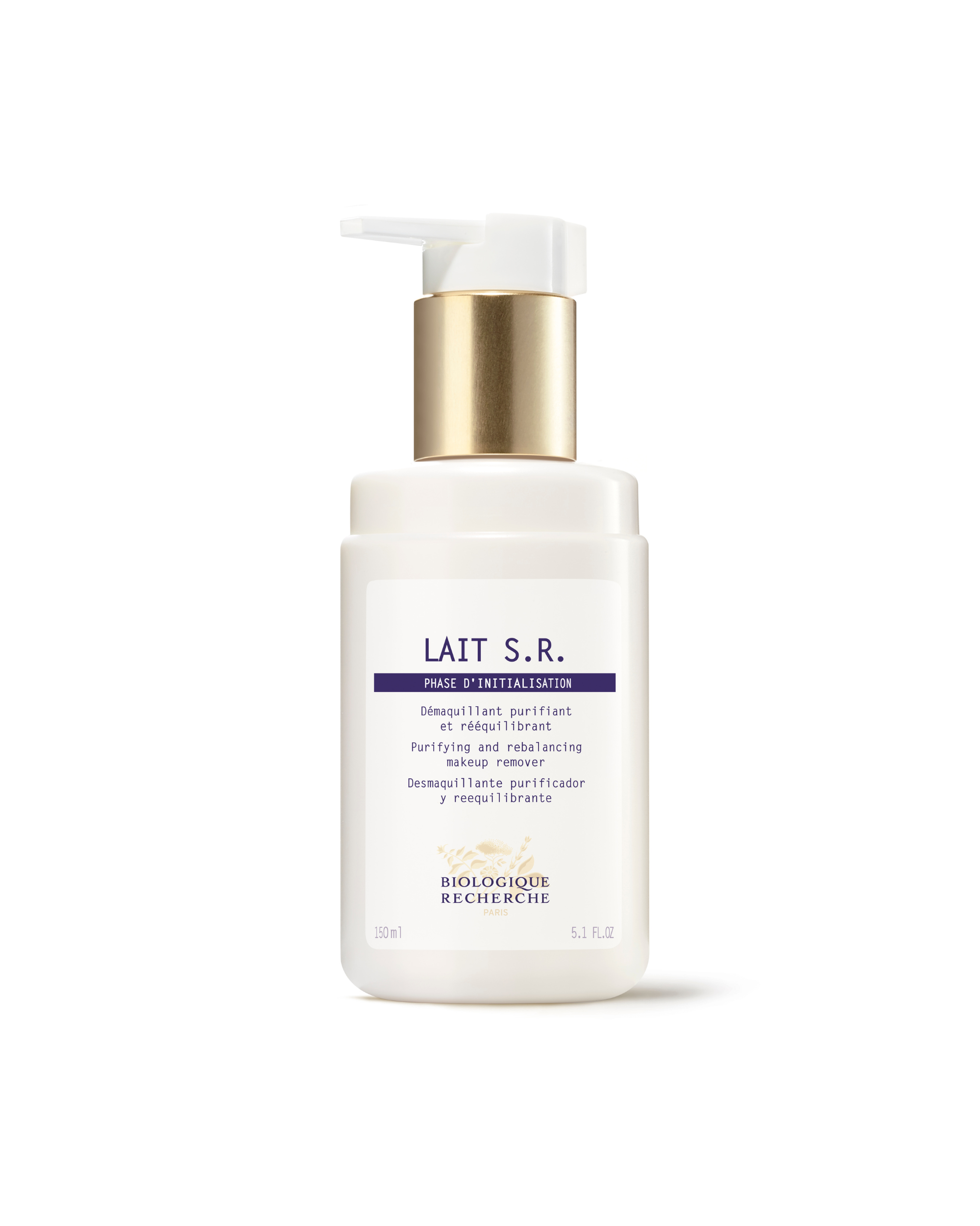 White pump bottle of Lait S.R. milk cleanser with gold collar and purple text on label.