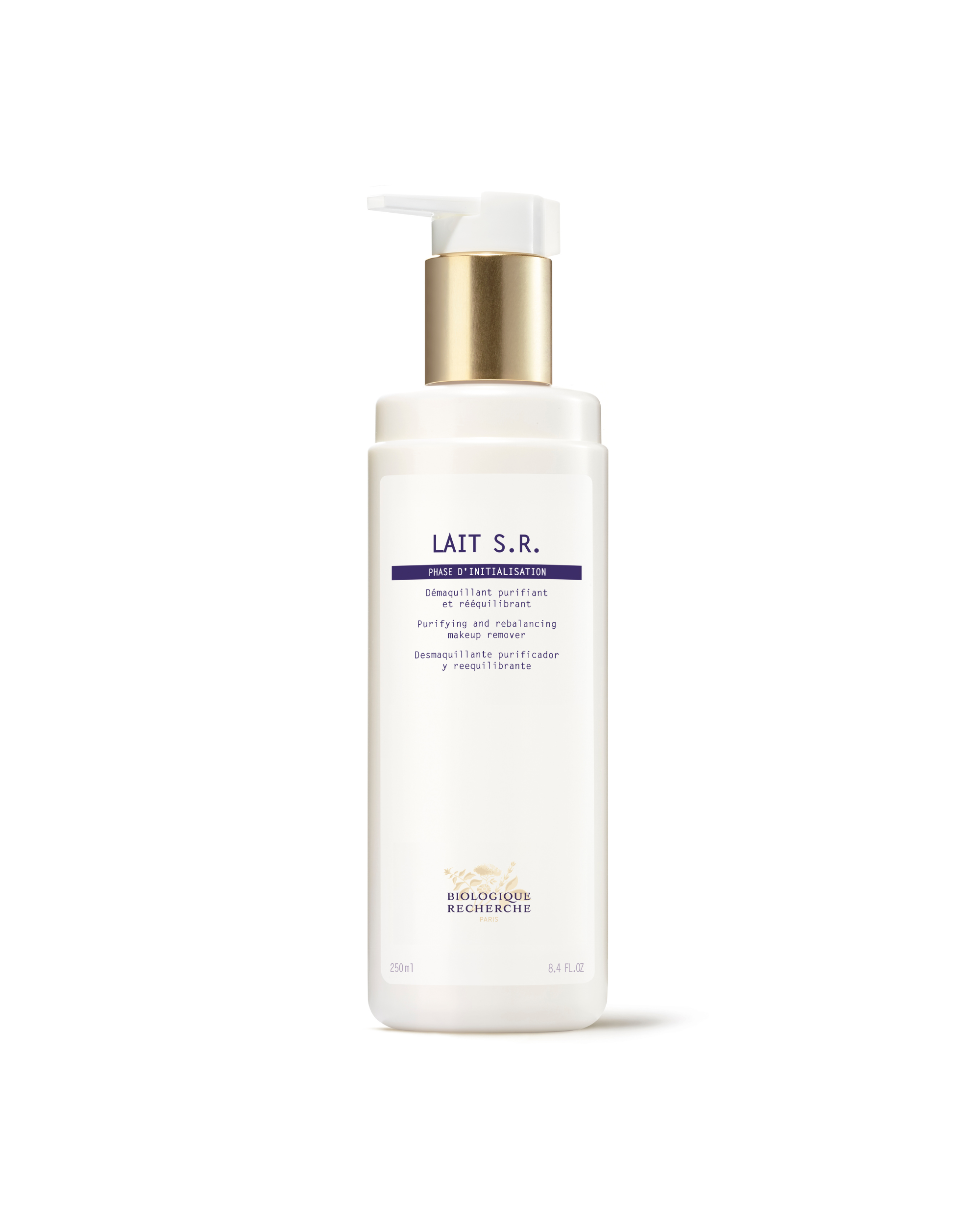 White pump bottle of Lait S.R. milk cleanser with gold and purple label detailing acne skin solution benefits.